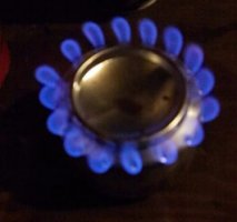 Stove with a lid on top and burning strongly